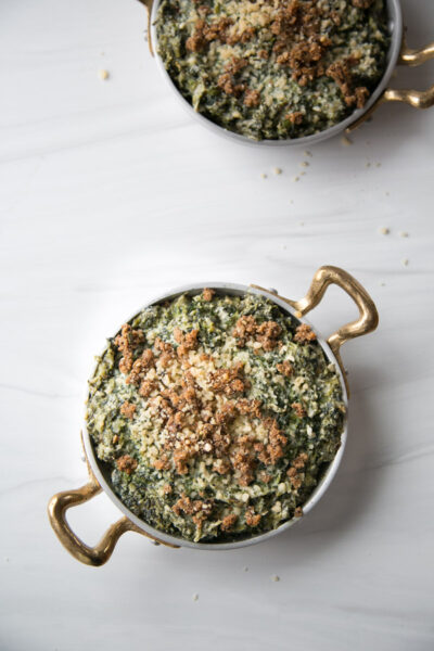baked dairy-free spinach dip with gluten-free breadcrumb topping warm