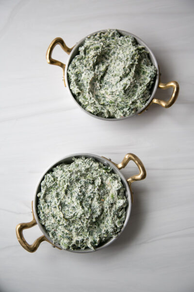 Dairy-free spinach mixture in two baking sheets