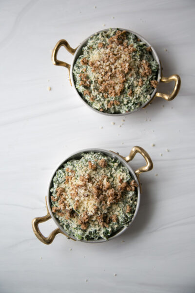 dairy-free spinach dip in ramekins with gluten-free breadcrumb topping