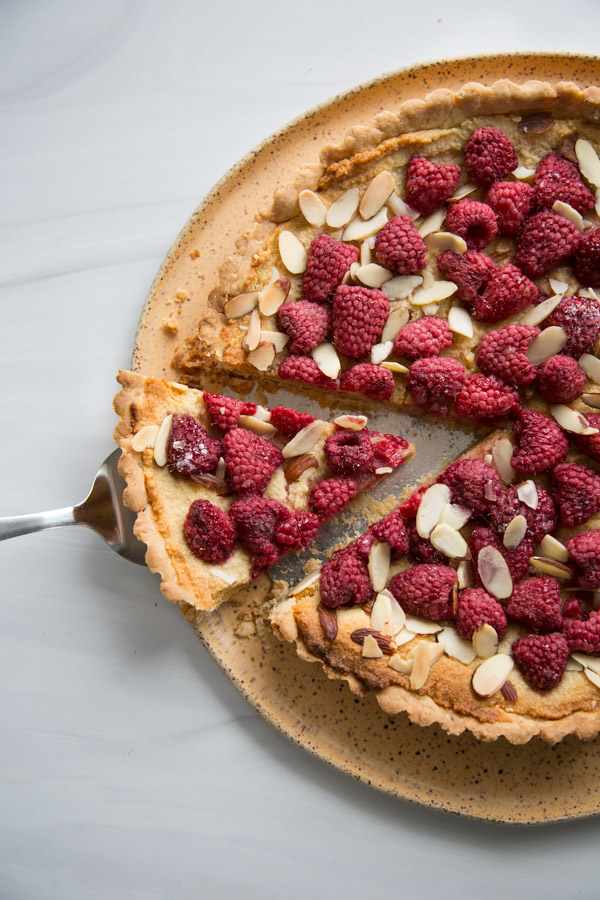 slice of almond and raspberry on a platter