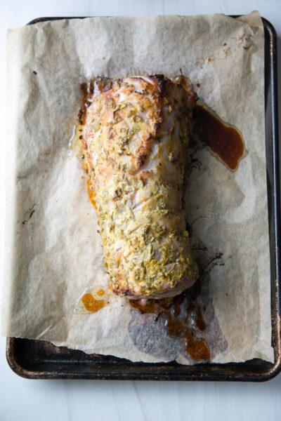 oven roasted boneless pork loin on a baking sheet