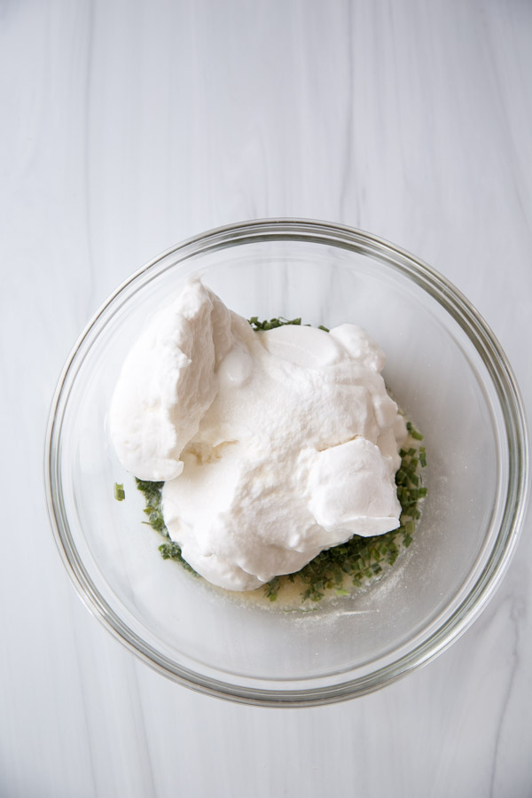 Mixing bowl with dry gluten-free vanilla mix and dairy-free yogurt for ranch dressing