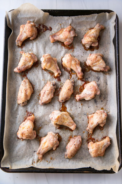 oven baked gluten-free chicken wings on a sheet pan