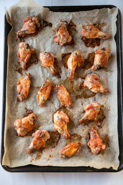 Oven baked gluten free chicken wings on a sheet pan