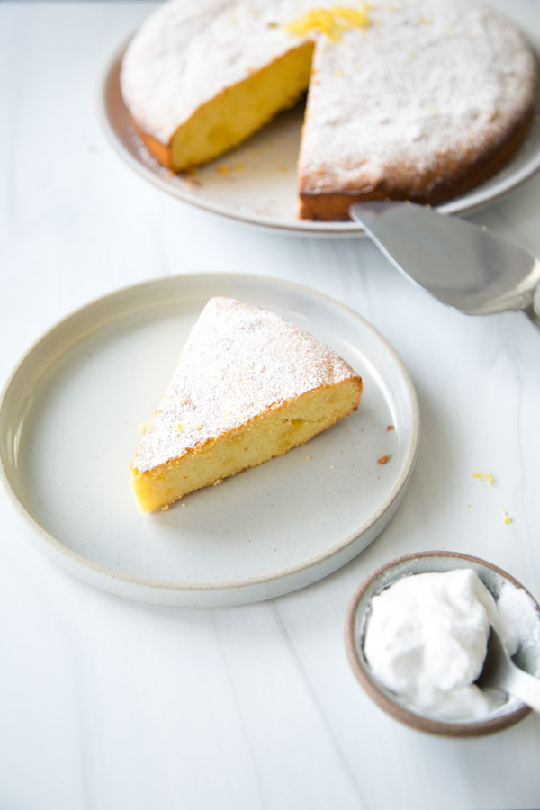 slice of dairy-free almond citrus cake for passover on a plate