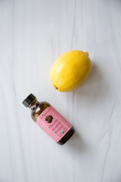 almond extract and lemon on a cutting board