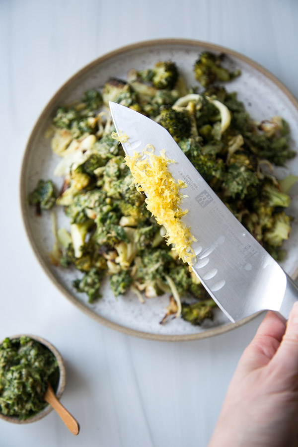 knife of lemon zest over low fodmap broccoli
