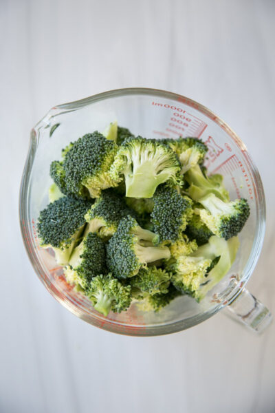 broccoli florets in a measuring cup