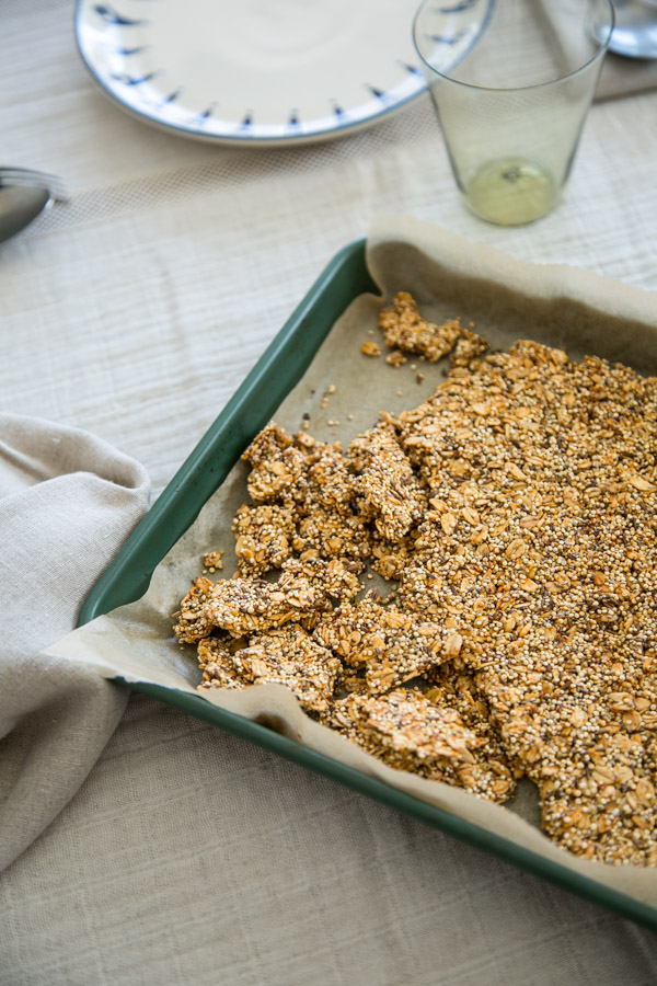 savory granola recipe on a sheet pan with napkin
