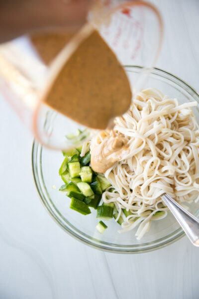 Pour the sesame sauce into the noodle bowl